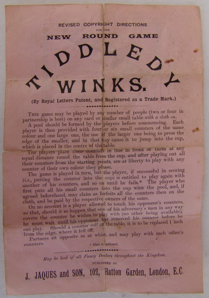 Tucker Tw ID • JAQ- — publisher • J. Jaques & Son — title • THE NEW ROUND GAME TIDDLEDY WINKS - PROTECTED